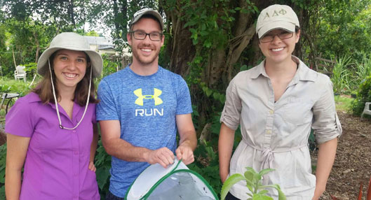 Zach Emberts in the field with two of his mentees. From left to right Rachel Ricker, Zach Emberts, and Paige Carlson.