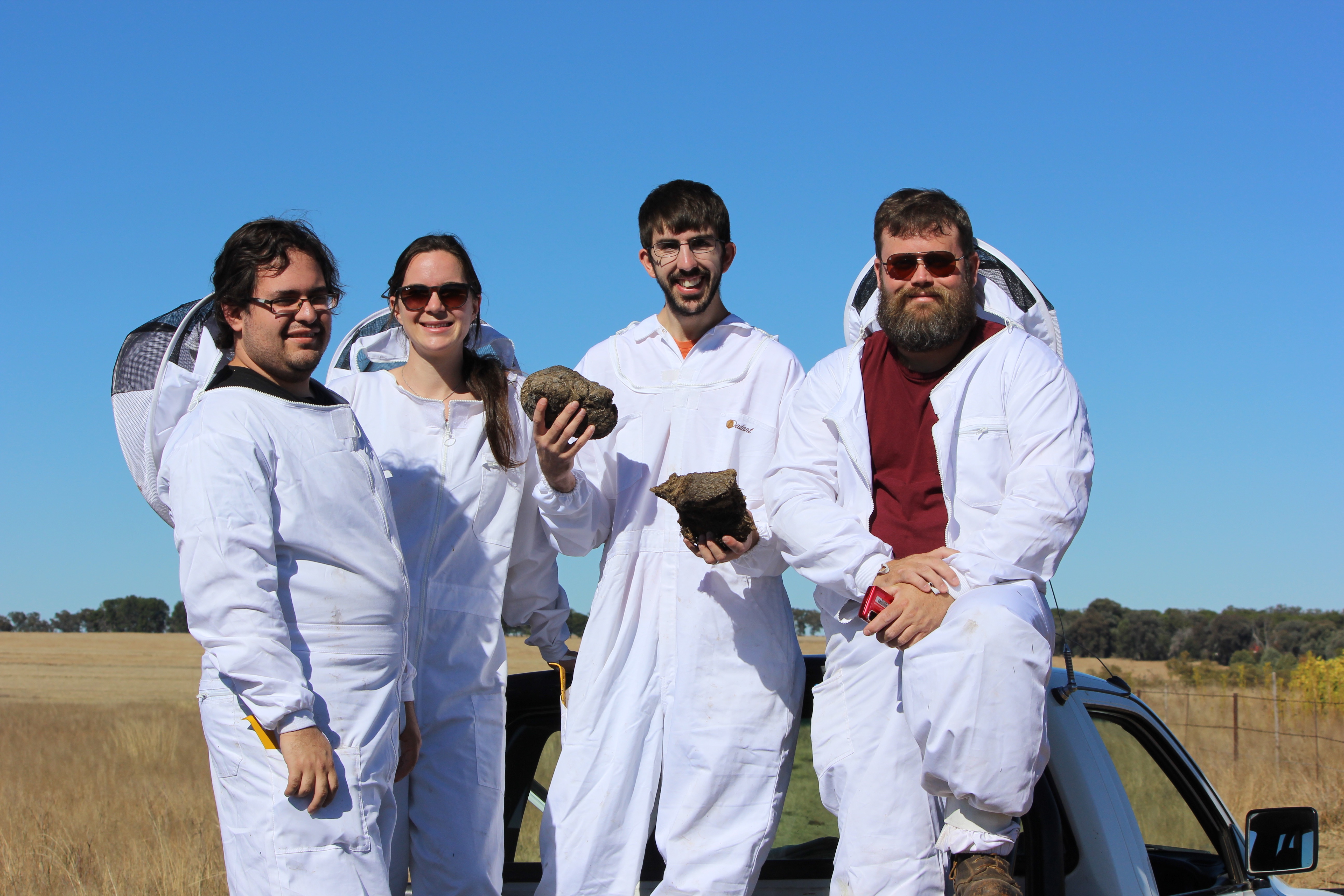 Graduate students in bee suits