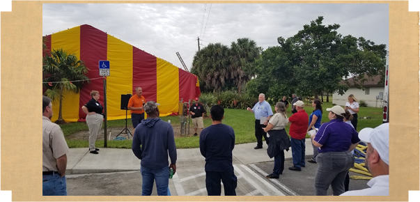 Image of Fume School Presentation in front of a house cover in an fumigated tank.