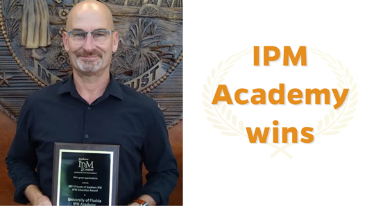 Dr.  Hugh A. Smith with the IPM Educator award plaque