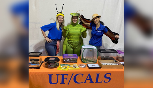 From left to right: Brynn Johnson, Grace Ortgiessen, and Jennifer Standley in front of their display for the 100+ Colombia County Sheriff’s Office campers out in Lake City on July 13th.