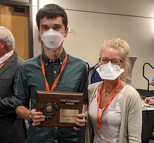 J McQueen pictured here with Dr. Porazinska, won the best student paper competition for his oral presentation “Species identity as a dominant driver for the assembly of nematode gut microbiomes in the Dry Valleys of Antarctica”. McQueen JP, Gattoni K, Gendron EJL, Sommers P, Darling J, Schmidt SK, Porazinska DL. at the 2021 Society of Nematologists Annual Meeting, Gulf Shores, AL. 